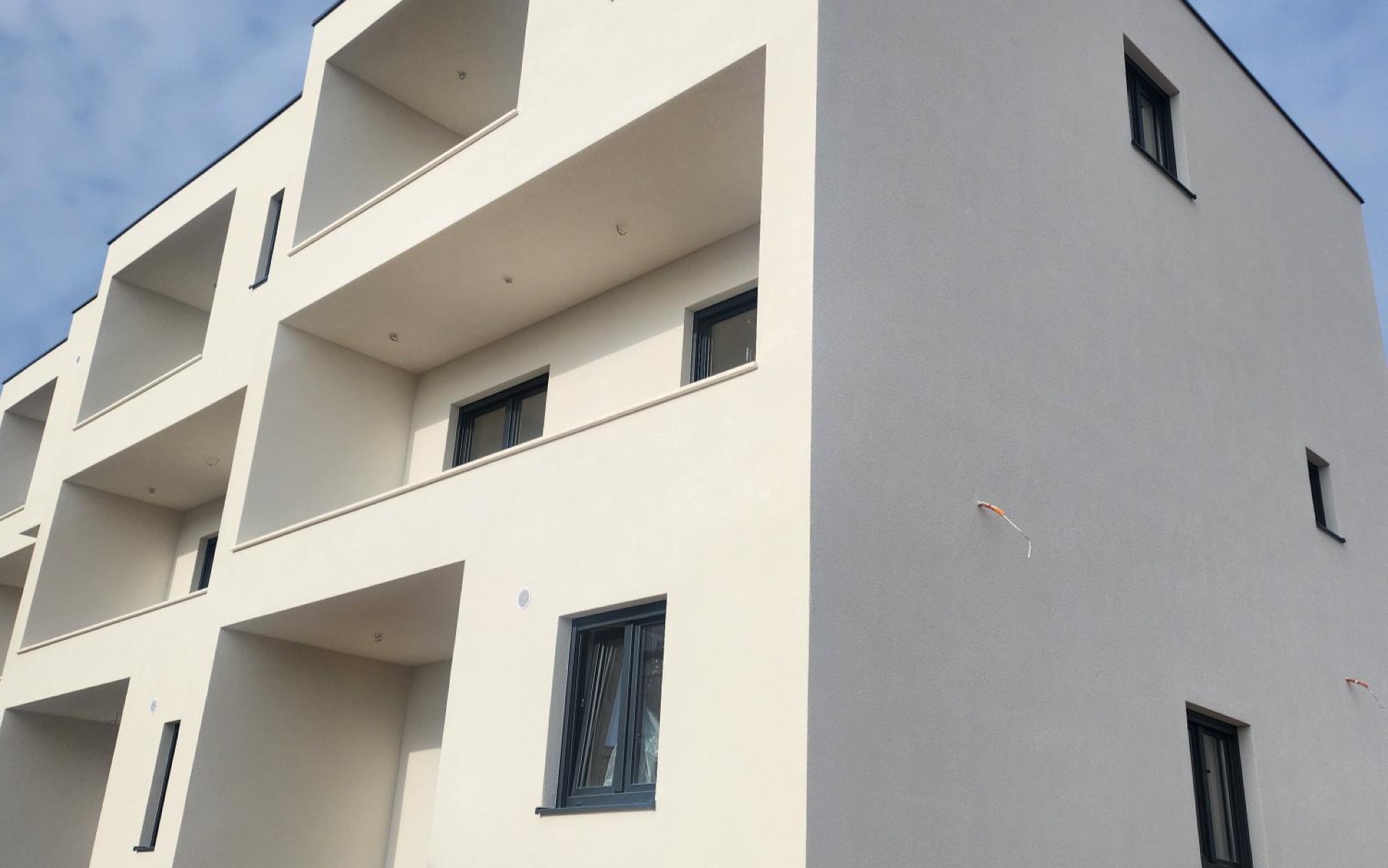 On the second floor of a new building, a one-bedroom apartment with a balcony